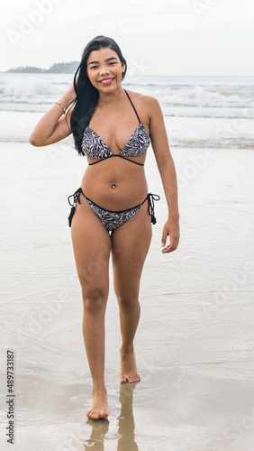 brazilian woman in bikini on the beach during summer