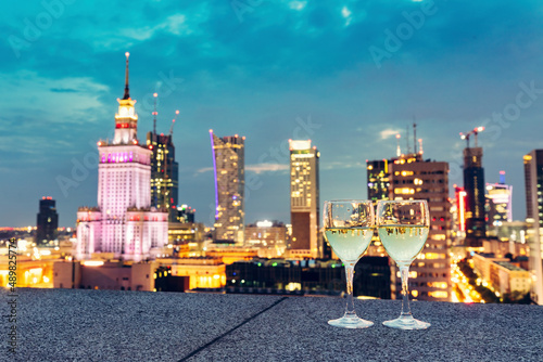 Wine with view on Warsaw, Poland at night