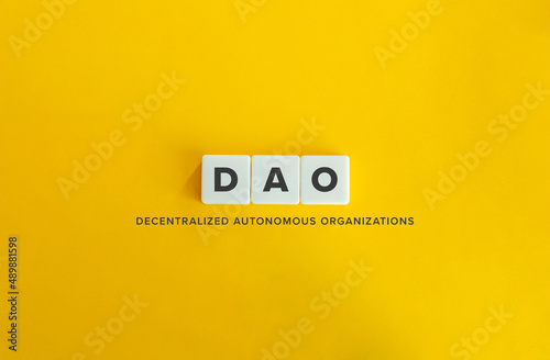 Decentralized Autonomous Organizations (DAO) Banner. Letter Tiles on Yellow Background. Minimal Aesthetics.