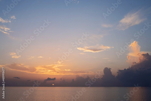 Sunrise on a flat calm morning at sea