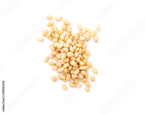 Heap of cedar or pine nuts isolated on white, top view.