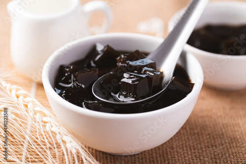 Grass jelly or herb jelly, dessert in Southeast Asia made from plant eating with syrup, bubble tea or other drinks