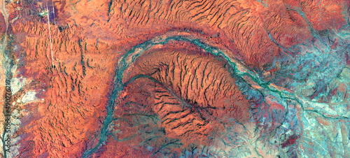 abstract landscape of the deserts of Africa from the air emulating the shapes and colors of the skin of the earth, 