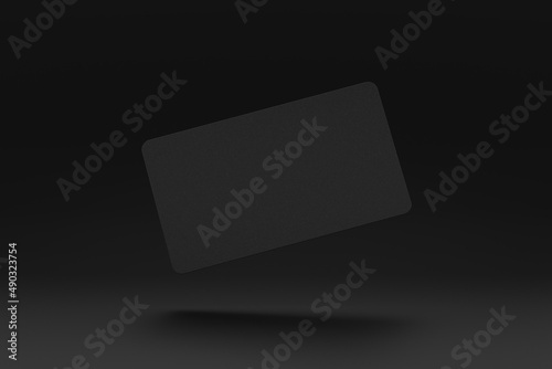 Realistic rounded corners floating black business branding card mockup with shadows for graphic design template. Blank credit card mockup over a dark background. 3D rendering