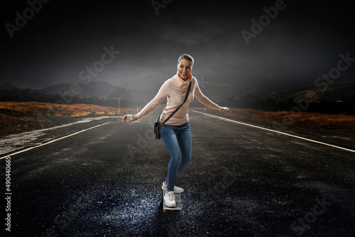Young woman riding her skateboard