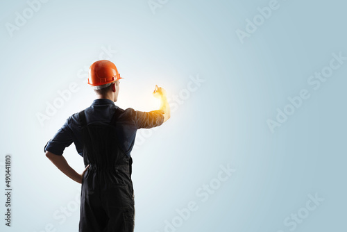 Male builder in the helmet