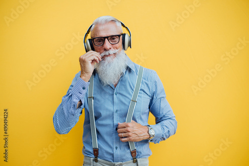Cool Senior hipster man with stylish beard. Modern business man urban portraits outdoor. Conceptual representation of aging as a state of mind