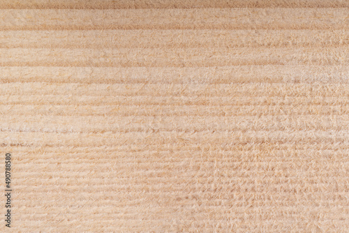drewniane tło z jasnego drewna sosnowego o regularnych słojach
