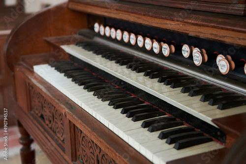 Old wooden harmonium inside a church