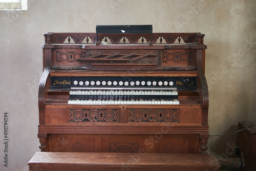 Old wooden harmonium inside a church