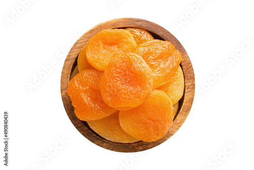dried apricots in wooden bowl isolated on white background. Vegan food, top view.