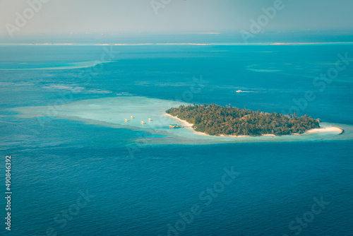 Fantastic aerial landscape, luxury tropical resort or hotel with water villas and beautiful beach scenic. Amazing bird eyes view in Maldives, landscape seascape aerial view over Maldives, traveling