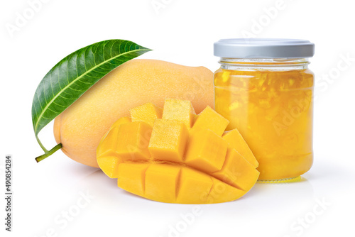 Mango jam in glass bottle and fresh mango fruit with green leaf isolated on white background.