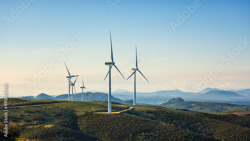 Turbines in a mountain wind farm. Ecological energy production.