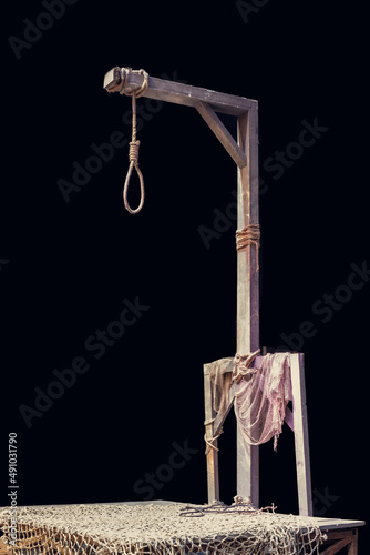 Wooden gallows and loop rope with dark background