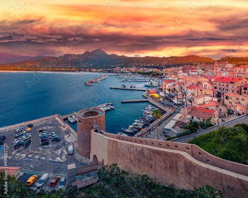 Superb evening cityscape of Calvi port. Incredible summer sunrise on Corsica island, France, Europe. Adorable seascape of Mediterranean sea. Traveling concept background.