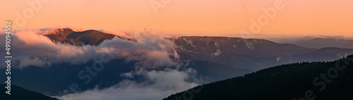 Petros Mountain in the morning fog, overcast mountain range at dawn, the magical mountains of Ukraine.