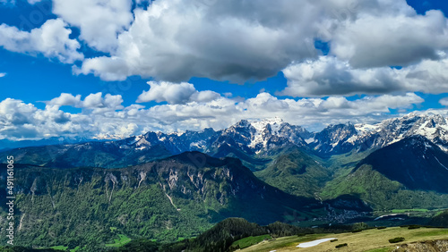 Panoramic view in spring from Frauenkogel on mountain peaks in the Karawanks and Julian Alps, Carinthia, Austria. Border with Slovenia. Triglav National Park. Jesenice in the Upper Drava valley. Hike