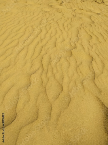Texture. Ukrainian desert under blue sky. The sand dunes and road in the desert, Oleshky Sands nature park, Oleshkivski pisky, Kherson oblast, Ukraine