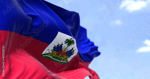 Detail of the national flag of Haiti waving in the wind on a clear day