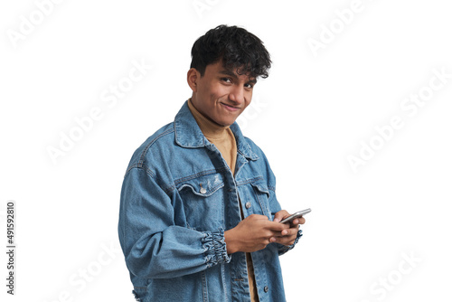 Young peruvian man using smartphone and looking at camera. Isolated over white background.