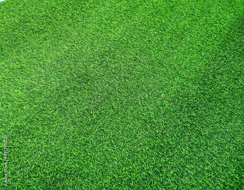 Field turf or artificial grass soccer field, green lawn background , green background.