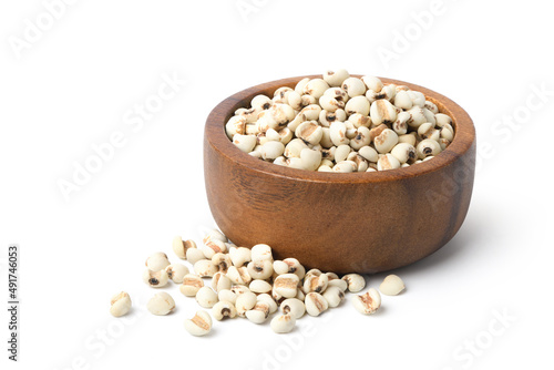 Job's tears ( Adlay millet) in wooden bowl isolated on white background.