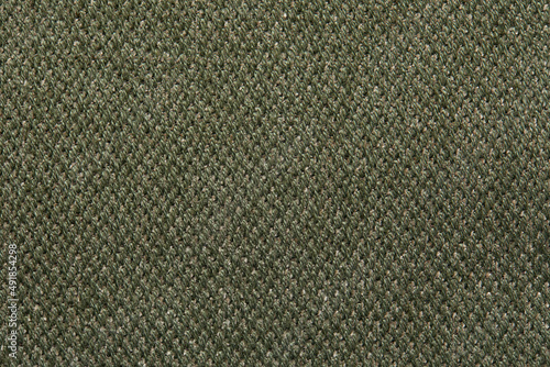 Green linen cloth close-up background. Fabric khaki teak canvas texture