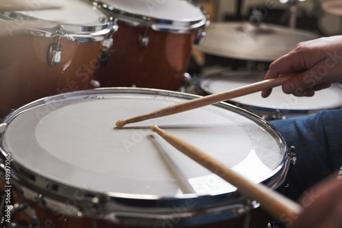 Drumroll, please. Cropped shot of an unrecognizable man playing the drums.