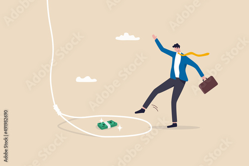 Money trap to trick greed people, danger fraud or threat to attack victim, financial or investment problem concept, greed businessman try to step into tricky rope trap to get money banknotes bundle.