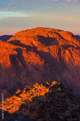 Sunrise on the summit of the Holy Mount Moses (Mount Horeb, Mount Sinai or Jabal Mousa), Egypt, Sinai, North Africa. Low exposure