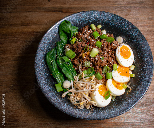 Japanese ramen sup with eggs, pak choi and ground beef 