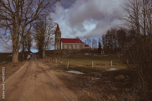 old lutheran church in Latvia countryside. God building on hill, Sece village 