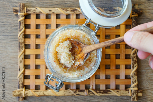 Homemade DIY skin scrub with epsom salt, honey and essential oils.