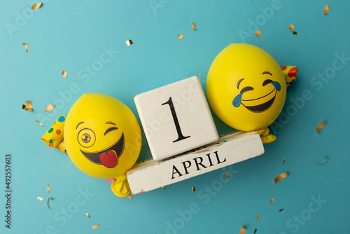 date April 1. Creative concept for April Fools' Day. Festive decor on the blue background