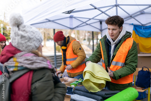 Volunteers distributing blankets and other donations to refugees on the Ukrainian border.