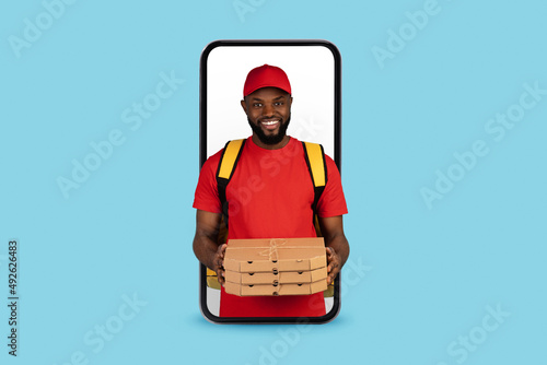Food Delivery App. Black Courier Guy With Pizza Looking Out Of Smartphone