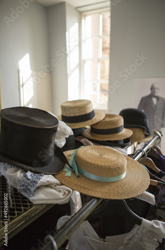 selection of straw hats in a vintage millinery shop no people nobody