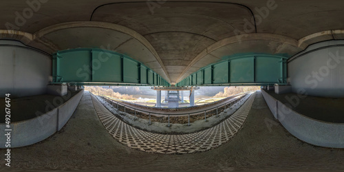 full hdri 360 panorama under steel frame construction of huge car bridge across river in seamless spherical equirectangular projection. VR AR content