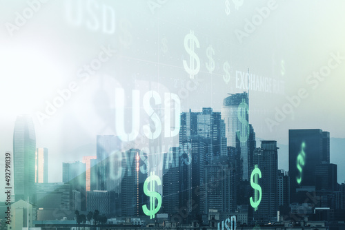 Double exposure of virtual USD symbols hologram on Los Angeles city skyscrapers background. Banking and investing concept