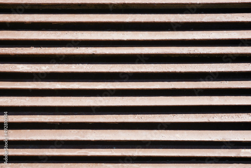 Metal stripes pattern. Ventilation grille texture. Industrial iron metal bars. Grunge grid lines. Gray metal frame background.