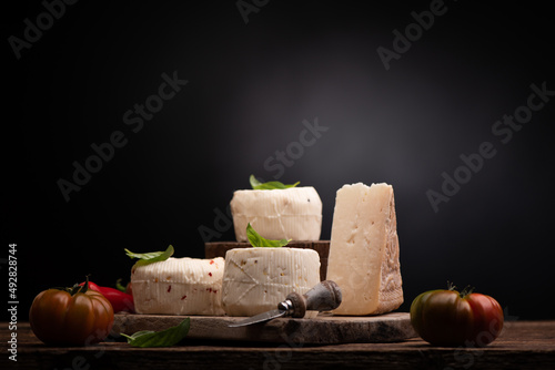 Sicilian cheeses on a black background with a place for text
