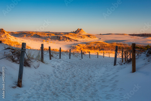 Beautiful scenery of sand dunes in the Slowinski National Park at sunset, Leba. Poland
