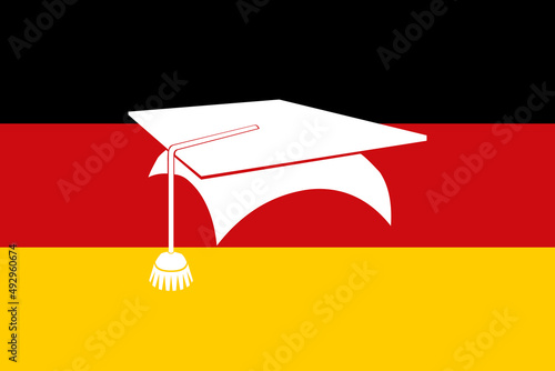 Deutsche Nationalfahne mit einem Doktorhut. Konzept Ausbildung und Studium in Deutschland