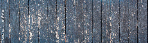 Naturalne Tło starej obdartej z farby ściany z drewnianych desek. 