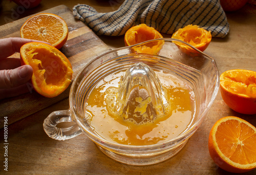 Making Freshly Squeezed Orange Juice with a Manual Citrus Press