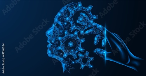 The control mechanism of the human brain. The finger of the hand in the form of a wrench regulates the gears in the head. Polygonal design of lines and dots. Blue background.