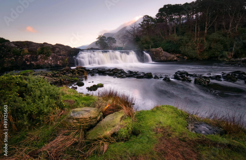 Beautiful nature scenery with waterfall on river Erriff with mountains in the background at Aesleagh, county Mayo, Ireland 