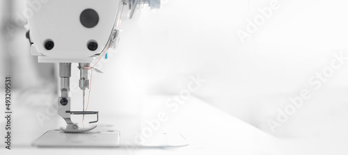 Banner industry tailor sewing machine on table workshop of white background
