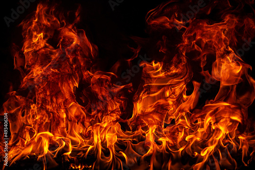 Fire blaze flames on black background. Fire burn flame isolated, abstract texture. Flaming explosion with burning effect. Fire wallpaper, abstract art pattern with copy space.